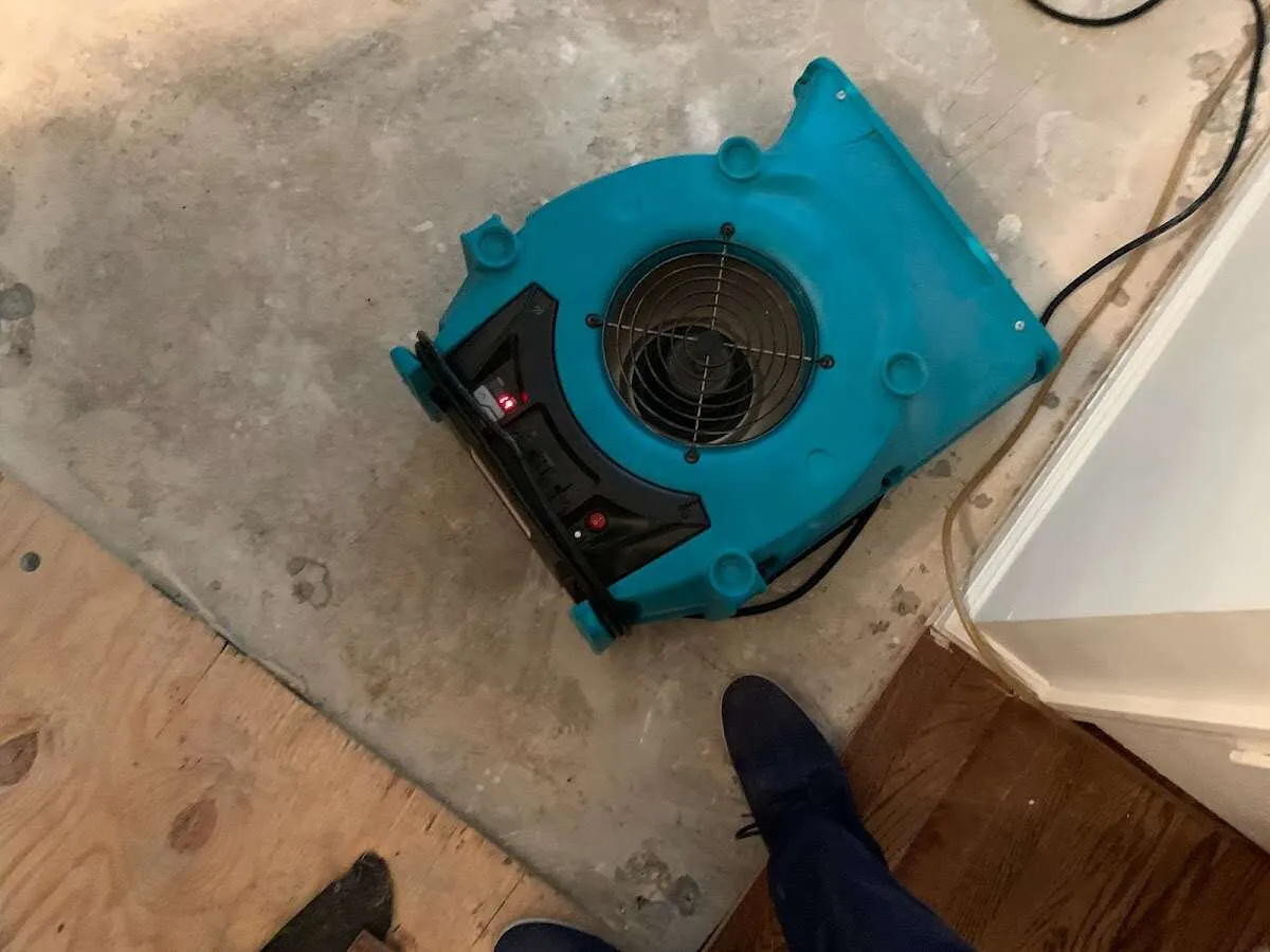 Air mover drying subfloor during Leak Detection & Repair in Lombard
